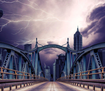 Three seperate lightning bolts captured above the bridge on a stormy day