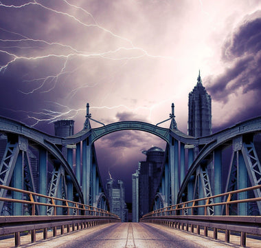 Three seperate lightning bolts captured above the bridge on a stormy day