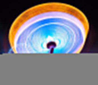 a colorful and moving ferris wheel shot at long exposure