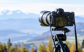 A DSLR pointed towards the view, to capture a timelapse video
